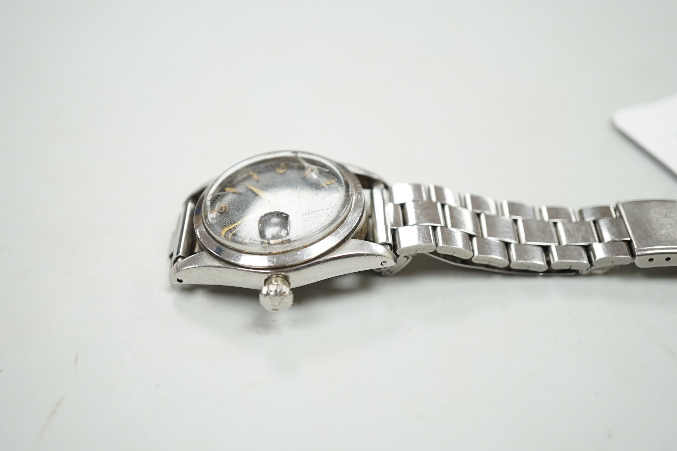 A gentleman's late 1950's? stainless steel Tudor Oysterdate manual wind wrist watch with black honeycomb dial, on associated stainless steel bracelet, case diameter 34mm, the case back numbered 7929 over 204837, no box o